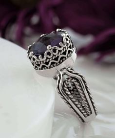 Looking for the perfect gift for your girlfriend, wife, mother, or sister? This gorgeous silver filigree art women's cocktail ring is the ideal choice. With its intricate details and beautiful face-up design, this ring is sure to stand out and make an impression. It features a double-sided, faceted checkerboard round-cut amethyst gemstone that measures 10mm and has a face size of 0.47 inches (12.00mm) in width. Not only is this ring stunning, but it also comes with a velvet pouch, silver polish Spiritual Crystal Ring With Stone Setting, Elegant Formal Birthstone Ring With Stone Setting, Elegant Birthstone Ring For Formal Occasions, Spiritual Stone Setting Crystal Ring, Elegant Amethyst Crystal Ring With Stone Setting, Elegant Silver Amethyst Ring With Stone Setting, Elegant Silver Amethyst Crystal Ring, Elegant Amethyst Ring For Anniversary With Stone Setting, Silver Filigree Amethyst Ring