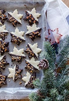 christmas cookies are arranged on a baking sheet