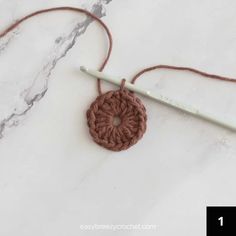 the crochet pattern is being used to make an ornament with yarn