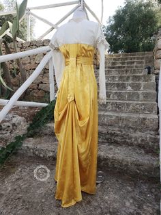 Regency Style Party Dress With Historical Design, Regency Style Historical Party Dress, Vintage Gold Dresses With Historical Design, Vintage Gold Dress With Historical Design, Regency Style Gold Dress With Historical Design, Silk Wedding Dress With Historical Design, Yellow Satin Floor-length Dress, Vintage Yellow Floor-length Dress, Elegant Yellow Vintage Dress