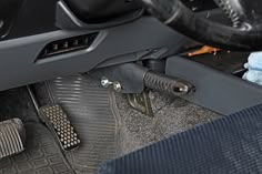 the inside of a car with its brake pads and pedals removed from the floor