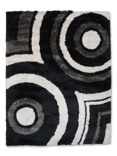 a black and white rug with circles on it