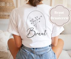 the back of a woman's t - shirt that says, braut and flowers