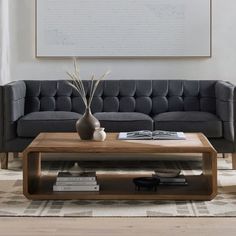 a living room scene with focus on the couch and coffee table