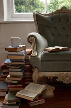 a chair sitting on top of a pile of books