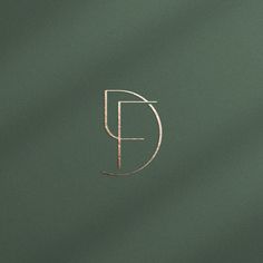 the letter p is drawn in gold on a dark green background with a thin line