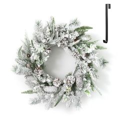 a white christmas wreath with pine cones and snowflakes