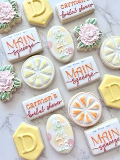 decorated cookies are arranged on a marble surface