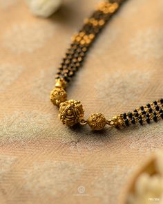 22kt Gold Antique Mangalsutra | Harit Zaveri Jewellers | Ahmedabad, India | WhatsApp : +917016466150 Antique Mangalsutra Designs Gold, Small Mangalsutra Designs Gold, Antique Mangalsutra Designs, Short Nallapusalu, Mango Mala Jewellery, Black Bead Chains, Antique Mangalsutra, Gold Black Beads, Mangalsutra Designs Gold