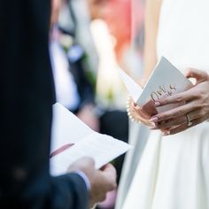 the bride and groom are exchanging vows at their wedding