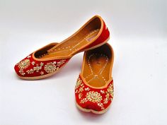 Ethnic Indian/Pakistani style shoes durable and hand stitched with genuine leather sole and leather padded cushion inside. These colors of this shoe consist of beautiful hand embroidered work and design pattern. One of our popular shoes for weddings, and formal events. These shoes are sure to make you beautiful with every outfit you try them on with! Sizes available US 6,7,8,9,10. Shipped from USA Khussa Photography, Embroidered Leather Flats With Flat Heel, Leather Embroidered Flats, Embroidered Leather Slip-on Flats, Traditional Round Toe Flats For Festivals, Festive Embroidered Leather Flats, Traditional Sandals With Rubber Sole And Flat Heel, Traditional Sandals With Flat Rubber Sole, Traditional Flat-heel Sandals With Rubber Sole