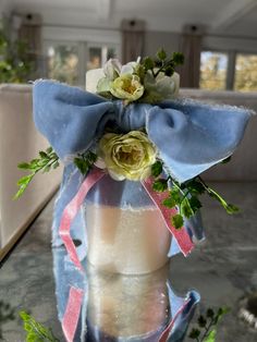 a vase filled with flowers on top of a table