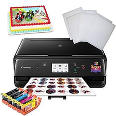 a canon printer and other items to be used for birthday cake decorating on the table