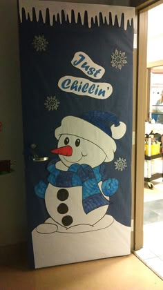 a door decorated to look like a snowman with the words first grade written on it