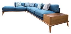 a blue sectional couch with pillows on it