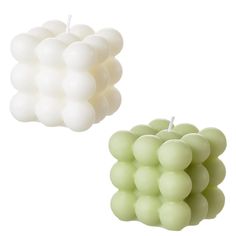 two candles that are shaped like grapes