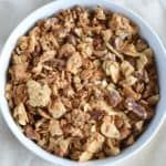 a bowl filled with granola sitting on top of a table