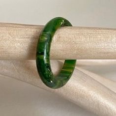 Antique Art Deco 1930s Bakelite band ring  In a vivid  green Bakelite ( tested) End of day piece which has the most fabulous  marbling pattern running through  Uk size N , US size 6 & 1/2 4mm wide Altogether, a great  Art Deco ring to wear & collect Marbling Pattern, End Of, End Of Days, Deco Ring, Art Deco Ring, Antique Art Deco, Gorgeous Earrings, Antique Art, Bright Green