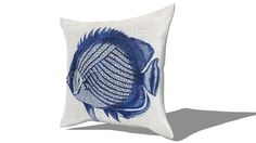 a blue and white pillow with a fish on it