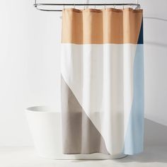 a shower curtain with an orange, white and blue stripe on it