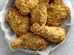 some fried food in a white bowl on a table