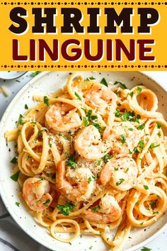 shrimp linguine in a white bowl with parsley on top