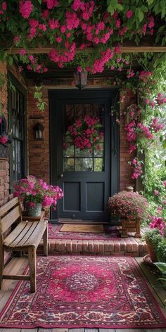 the front door is covered with pink flowers