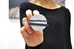 SHANGHAI is a circle brooch with a geometric shape in aluminum and black. It's a modern and minimalist brooch with a contemporary design, made of aluminum and slate strips, cut and smoothed. The front face of the stone is left to 'split' to enhance its nature. You can also use it as a shawl pin Perfect as a gift to a friend! Entirely handmade in Italy. The slate, which comes from the waste processing of companies in the province of Genoa, is recovered, recycled and worked again. This type of wor Green Brooch, Unique Brooch, Alternative Jewelry, Shawl Pin, Handmade Pins, Sterling Silver Brooch, Shawl Pins, Pearl Brooch, Brooches Handmade