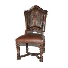 a brown leather chair sitting on top of a white wall