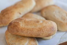 four pieces of bread sitting on top of a white napkin