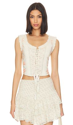 Find LOVESHACKFANCY Corvelle Bustier Top In Cream on Editorialist. LoveShackFancy Corvelle Bustier Top in Cream. - size 12 (also in 14) LoveShackFancy Corvelle Bustier Top in Cream. - size 12 (also in 14) 100% cotton. Made in India. Hand wash. Hidden side zipper closure. Lace-up front. Lightweight linen fabric with frayed ruffle trim. Item not sold as a set. LESH-WS276. T1032-1592. LoveShackFancy is a collection of hand-dyed and printed silk dresses and separates. It embodies a lux bohemian life Fitted Bohemian Corset For Spring, Bohemian Sleeveless Corset For Summer, Printed Silk Dresses, Elegant Dinner Party, Silk Dresses, Bohemian Lifestyle, Elegant Dinner, Lace Inset, Bustier Top