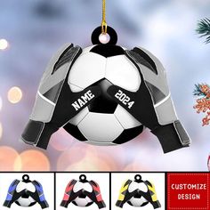 personalized soccer ball ornament hanging from a christmas tree with four different colors