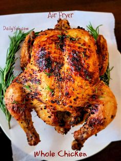 a whole chicken sitting on top of a white plate