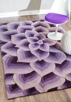 a purple area rug on the floor in a room