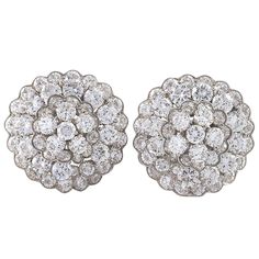 A splendid example of the house’s fascinating floral jewelry, these Van Cleef & Arpels Paris diamond stud earrings, designed in a stunning clustered bloom, emanate light and beauty. A domed, dimensional gathering of diamonds radiating from a central stone alternates prong- with bezel-setting to create a rosette pattern that exhibits a charming, subtle naturalism. Artist: Van Cleef & Arpels, Paris Country: France Circa: 1980s Size: 1” diameter Materials: 104 Circular-cut diamonds (approximate tot Gallery Jewelry, Van Cleef And Arpels Jewelry, Yellow Gold Diamond Earrings, Van Cleef & Arpels, Platinum Earrings, Van Cleef And Arpels, Jewelry Catalog, Floral Jewelry, Diamond Stud Earrings