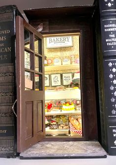 an open book case filled with lots of books