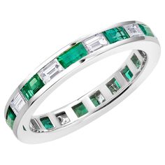 Introducing our exquisite Platinum Baguette-Shaped Diamond and Emerald Channel Set Eternity Ring, a timeless symbol of eternal love and commitment. This stunning piece is meticulously crafted to perfection, showcasing the harmonious blend of brilliant diamonds and vibrant emeralds. Design: The ring features a sophisticated channel set design, where pristine baguette-shaped diamonds weighing a total of 1.25 carats are seamlessly interspersed with alluring baguette emeralds weighing 1.35 carats. T Emerald Eternity Ring, Emerald Band Ring, 2 Carat Diamond Ring, Memory Ring, Channel Set Rings, Emerald Band, Ring Baguette, Emerald Cut Diamond Ring, Solitaire Rings