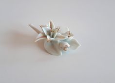 Exquisite unique Vintage white porcelain ceramic gold trim flower and buds bouquet brooch pin. 2.5 x 2 x 1 inches. Good vintage condition - sold as is -return not accepted.   To make this a smooth and pleasant transaction experience for everyone, all buyers need to read and understand the description, the terms of sale , the payment and the shipping indicated in this listing. Good condition. Return not accepted - please ask before purchase. Thank you for watching our other items! A large collect White Flower Enamel Pin For Wedding, Broche Bouquet, Bouquet Brooch, Brooch Bouquets, Porcelain Ceramics, White Porcelain, Gold Trim, Unique Vintage, White Vintage