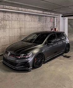 a grey car parked in a parking garage