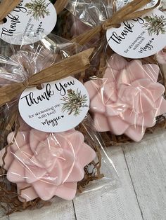 pink soaps wrapped in cellophane with thank you tags