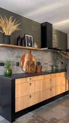 a woman standing in front of a kitchen counter