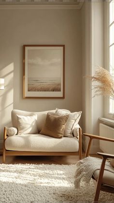 a living room scene with focus on the couch and chair in the foreground, light coming through the window