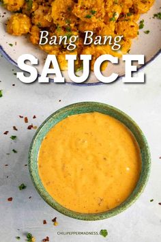 a bowl of sauce next to a plate of food on a table with the words bang bang sauce