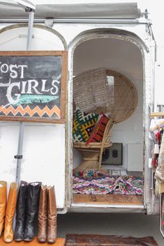 the inside of a truck with lots of different items on display in front of it