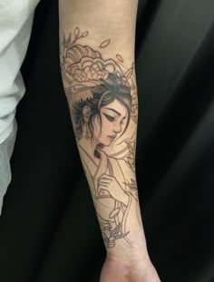 a person with a tattoo on their arm