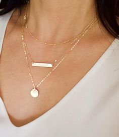 "Set of 3 Layering Necklaces in Sterling Silver, 14k gold filled, or rose gold filled. Personalized hand stamped necklace in 14K Gold Filled with a long rectangle bar stamped with initials. Feel free to customize the bar with your initials, names, date of birthday, etc. ------------------------- The 3 pieses are separate, so you can wear them separately or layered together. Each of these pieces is beautiful on its own. Buy as a layering set and save ------------------------- - The bar is thick a Bar Necklace Layered, Lingot D'or, Hand Stamped Necklace, Necklace Initial, Gold Bar Necklace, Monogram Jewelry, Infinity Ring, Chain Extenders, Feather Necklaces