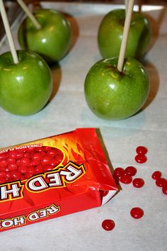 some apples and candy on a table