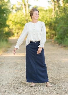 Tried and True just for you! The Stella Navy Night Denim Maxi Skirt is a customer favorite we know you'll love. Now available in this beautiful navy color, this skirt is a wardrobe staple and one of our best sellers! The long denim is accented by a silver button with the Inherit Badge Logo and tailored in a straight fit. There is a 14" back slit to make walking a breeze! No details were missed with this skirt! style or personal preference. Aline Midi Skirt, French Capsule Wardrobe, Long Jean Skirt, Hijabi Outfits Casual, Hijabi Outfits