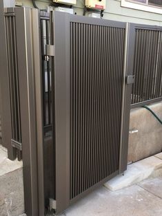 an open metal door on the side of a building