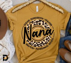 a t - shirt with the word nama written in leopard print on it next to some shoes